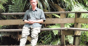 Go barefoot like the locals in New Zealand Bare feet admiring the hugest giant kauri tree at Waipoua Forest