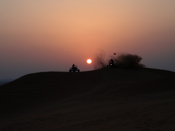 Sunset over sand dune on desert near Dubai, UAE