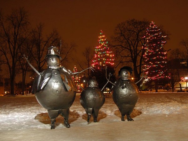 Snowman and Christmas light on snow covered Victoria Park, London, Canada