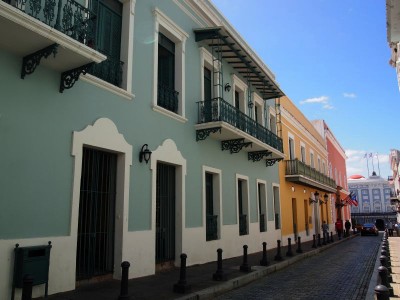 Colorful houses and dark blue cobblestone in Old San Juan, Puerto Rico