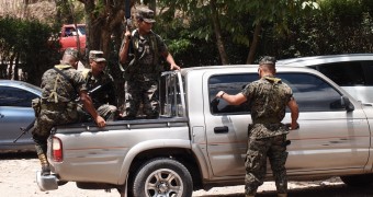 Woken by explosions at 5 am in Honduras Army with rifles guarding the Mayan ruin Copan, Honduras