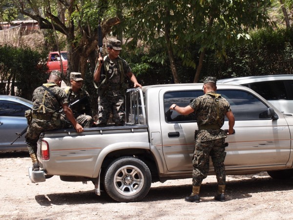 Army with rifles guarding the Mayan ruin Copan, Honduras