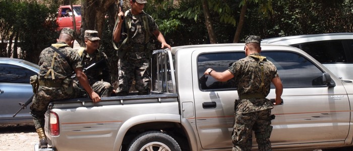 Army with rifles guarding the Mayan ruin Copan, Honduras