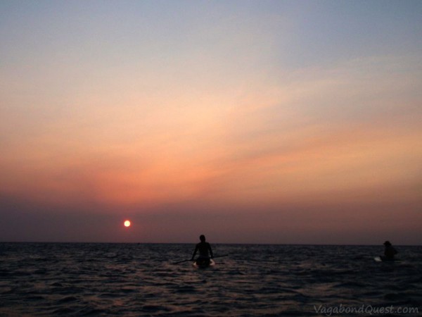 Sunset paddleboarding in Half Moon Bay, Roatan Island, Honduras