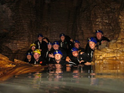 Black water rafting in underground river of the Waitomo glowworm cave, New Zealand