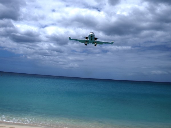 Landing airplanes in Maho Bay Beach, Sint Maarten, Caribbean