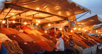 The Old City of Marrakech: Life Behind the Walls Vendor at Jemaa el-Fnaa - Medina Quarter of Marrakech, Morocco