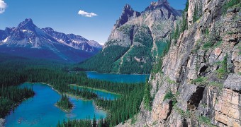 Rocky mountain cliffs and Lake O'Hara in Yoho National Park, British Columbia, Canada.