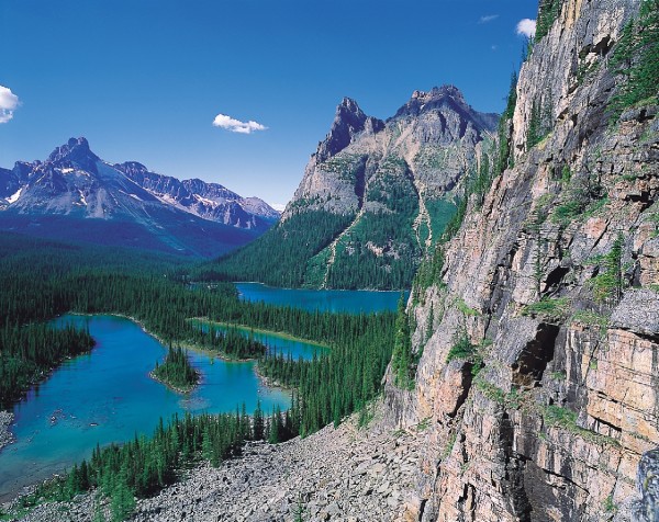 Rocky mountain cliffs and Lake O'Hara in Yoho National Park, British Columbia, Canada.